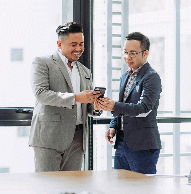 global investor two men in-high rise conference room